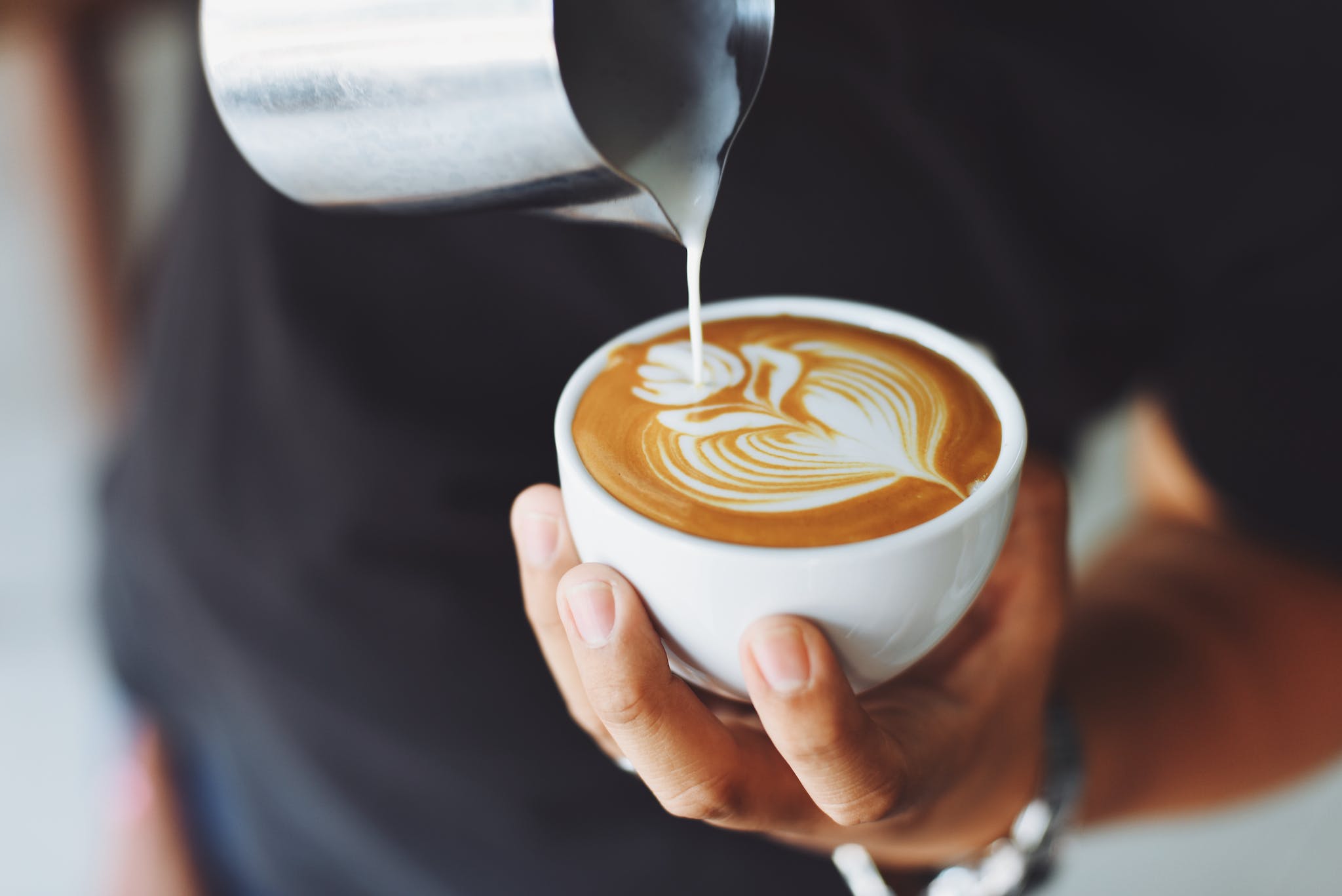 Person Performing Coffee Art decaf coffee