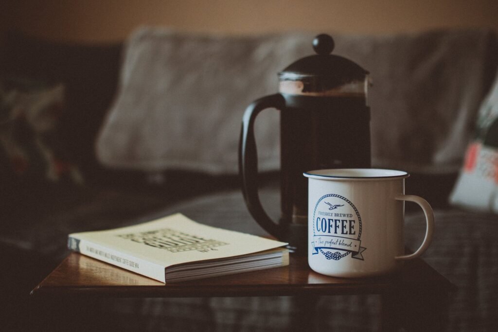 Closed Book Beside French Press and Mug - Make French Press Coffee Stronger
