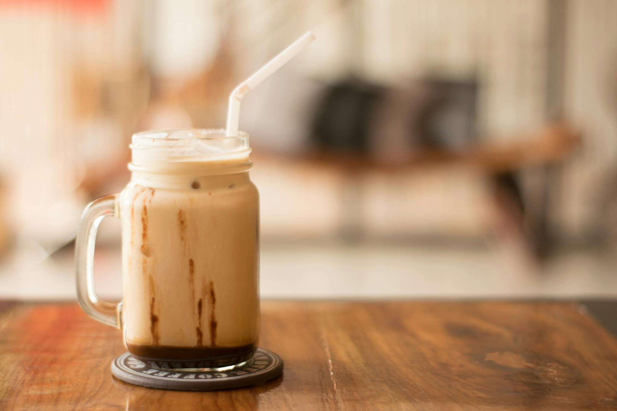 Shallow Focus Photography of Clear Glass Cup aeropress iced coffee