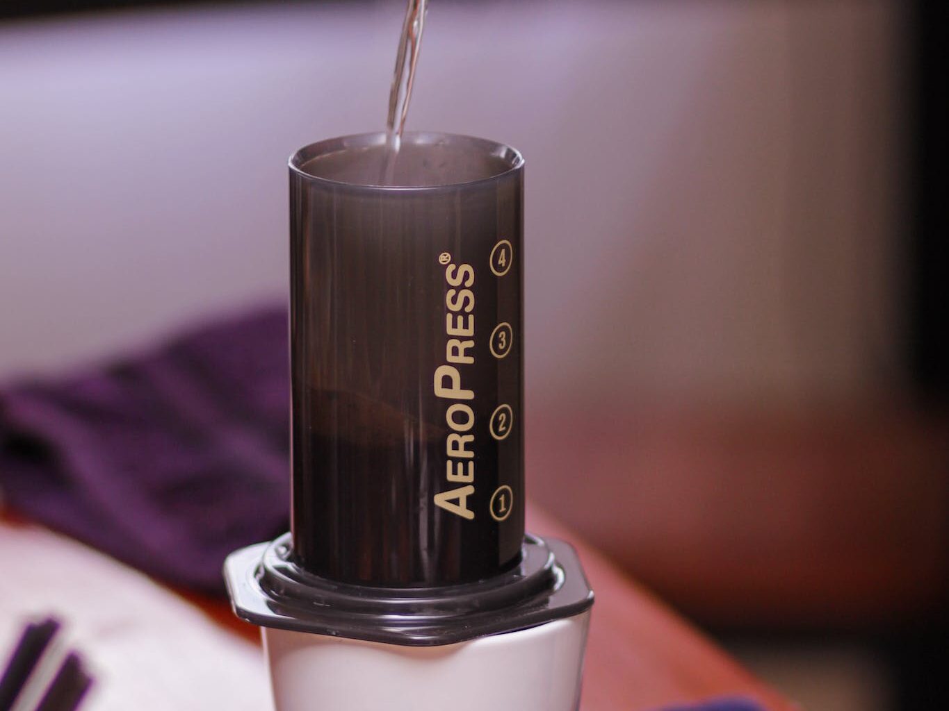 Water Being Poured Into a Manual Coffee Maker Aeropress accessories